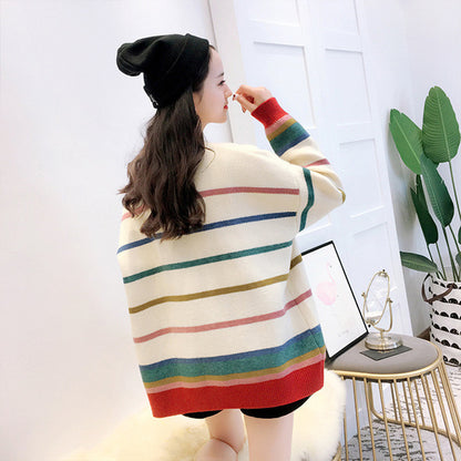 Trendy women's sweater cardigan featuring vibrant rainbow stripes for a bold fashion statement.